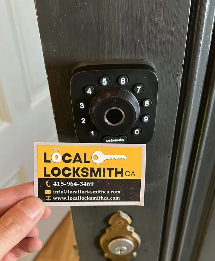 Fingerprint and keypad smart lock on a dark door