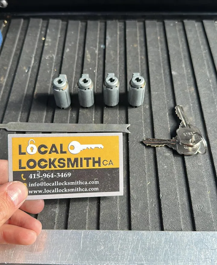 Four rekeyed lock cylinders with new keys on the van tray